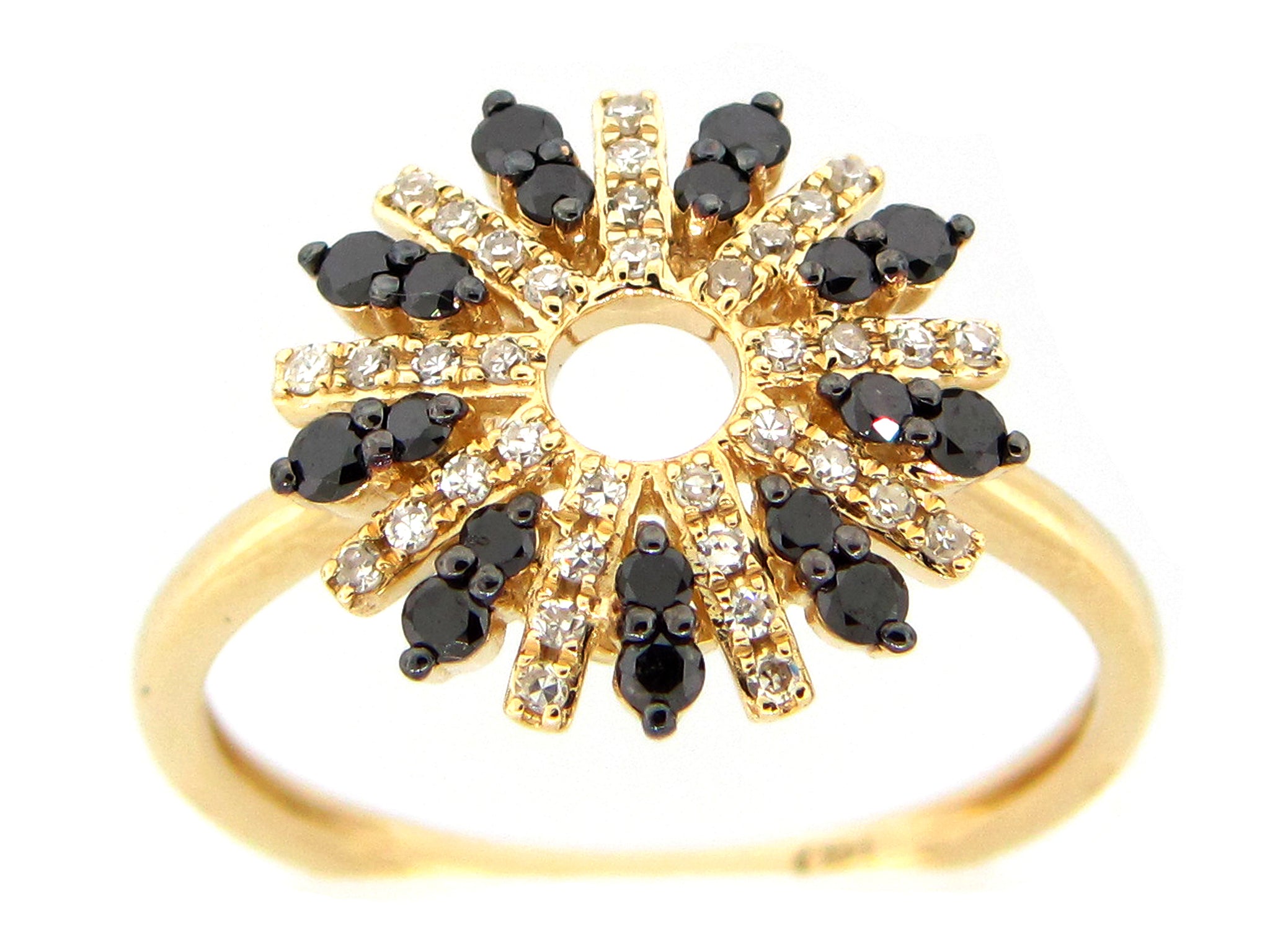 A starburst pattern ring with alternating rows of black and white diamonds.