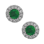 Earrings with a round center emerald stone surrounded by small round diamonds.