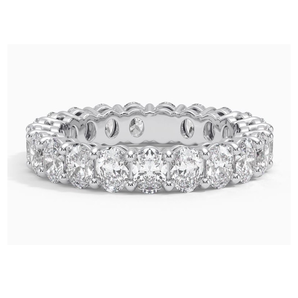 Front view of a oval lab grown diamond eternity band set in white gold. 