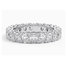 Front view of a oval lab grown diamond eternity band set in white gold. 