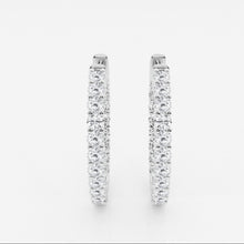 Front view of lab grown diamond hoop earrings set in white gold. 