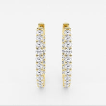 Front view of lab grown diamond hoop earrings set in yellow gold. 