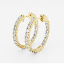 Side view of lab grown diamond hoop earrings set in yellow gold. 
