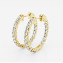 Side view of lab grown diamond hoop earrings set in yellow gold. 
