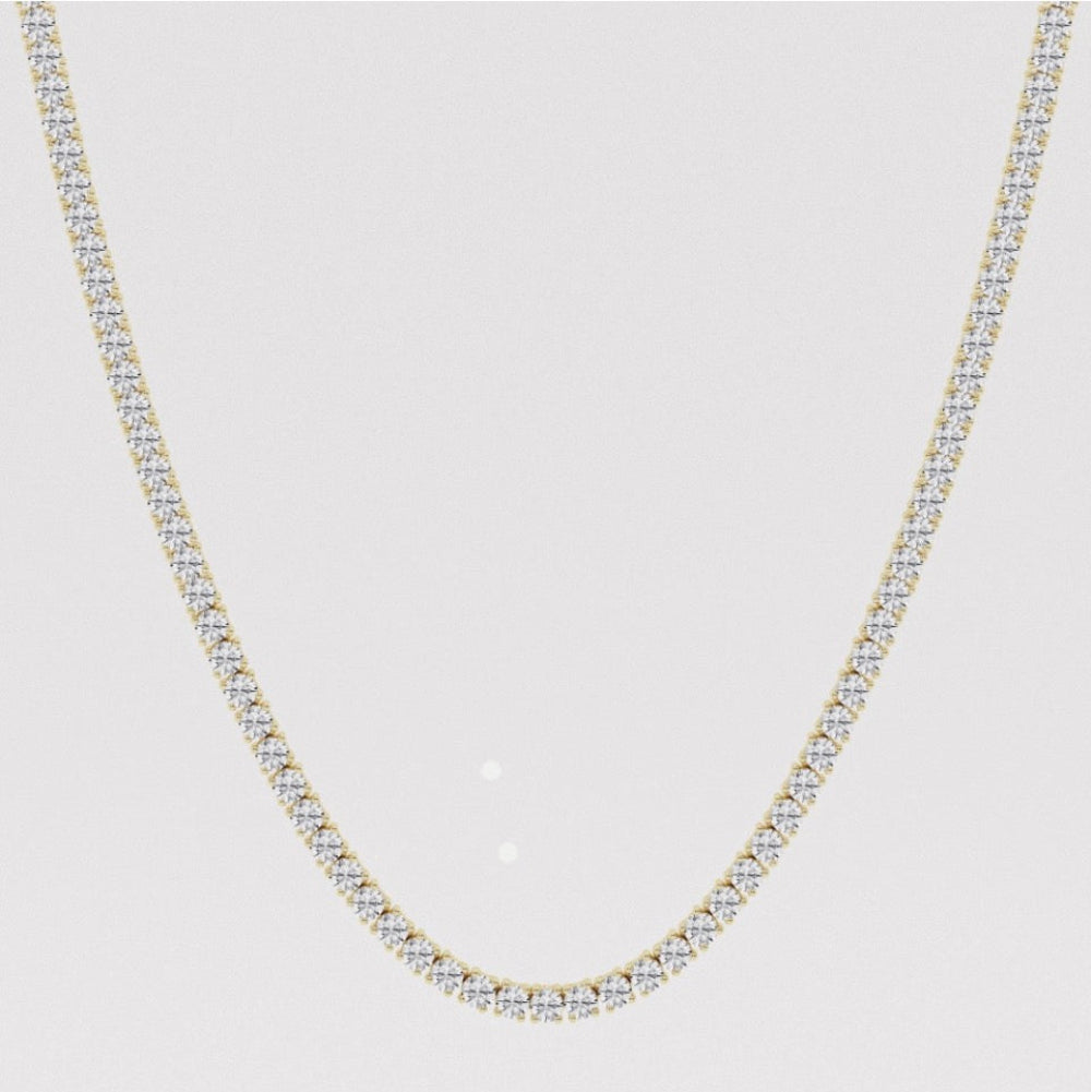 Lab grown diamond tennis necklace with four prongs in yellow gold. 