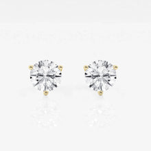 Pair of lab grown diamond stud earrings with gold prongs. 
