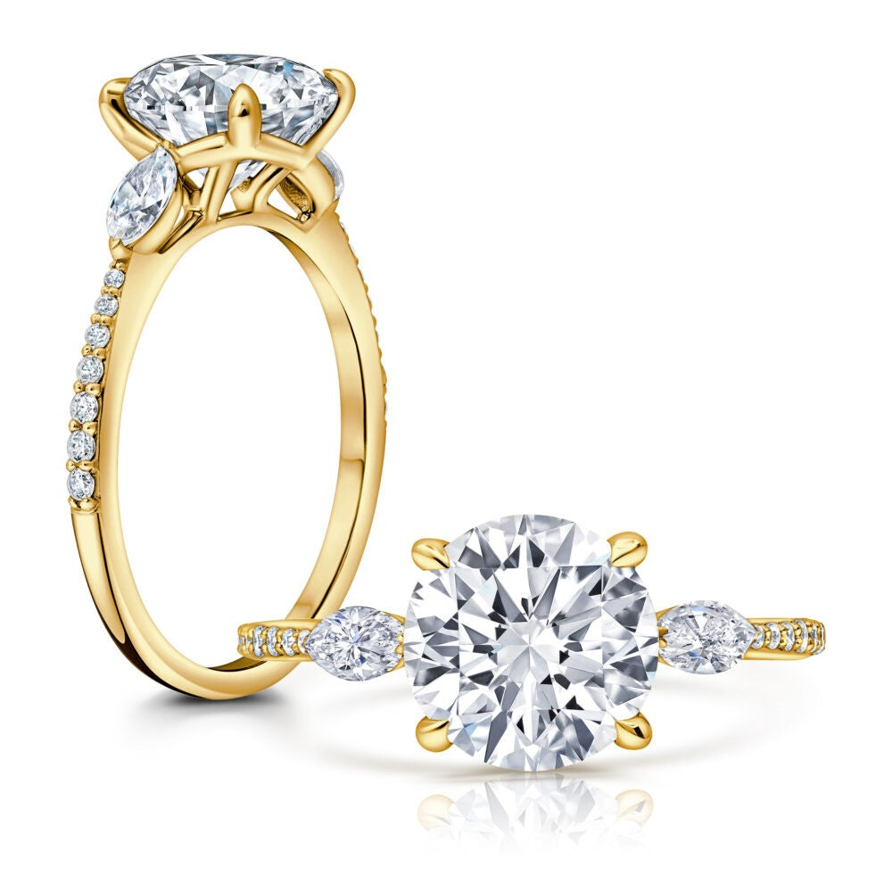 Side view of Round Lab Grown Diamond Engagement Ring with Marquis Side Stones set in 14k yellow gold