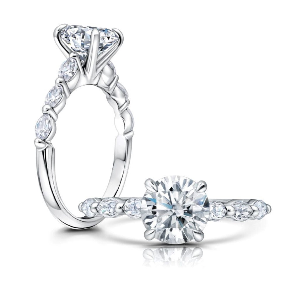 Front and Side View of a Round Diamond Engagement Ring with Three Side Stones set in White Gold