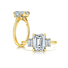 Front and side view of an Emerald Diamond Engagement Ring with Emerald Side Stones set in yello gold.