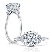 Front and side view of a Round Diamond Engagement Ring with Cluster Marquis Side Stones set in white gold.