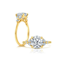 Front and side view of a Round Diamond Engagement Ring with Cluster Marquis Side Stones set in yellow gold.