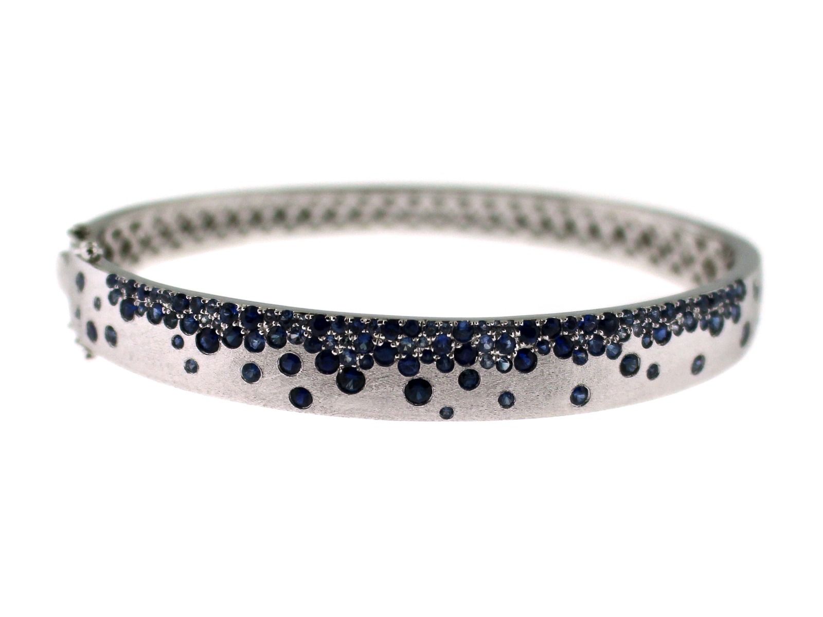 White gold bangle bracelet with sprinkled with small round black diamonds 